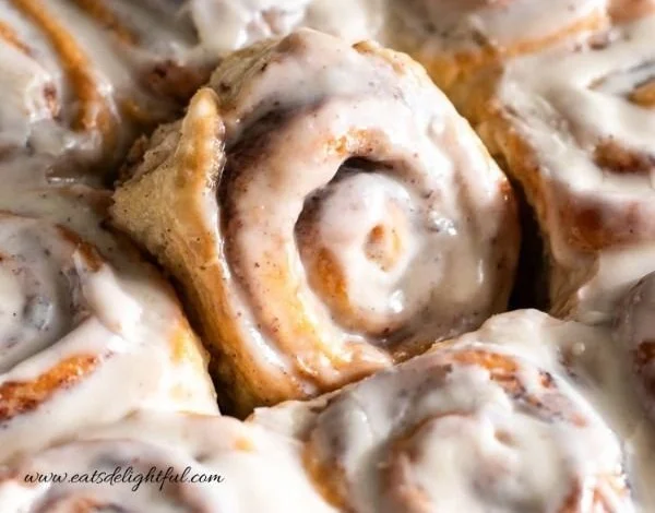Freshly baked homemade cinnamon rolls with icing on top