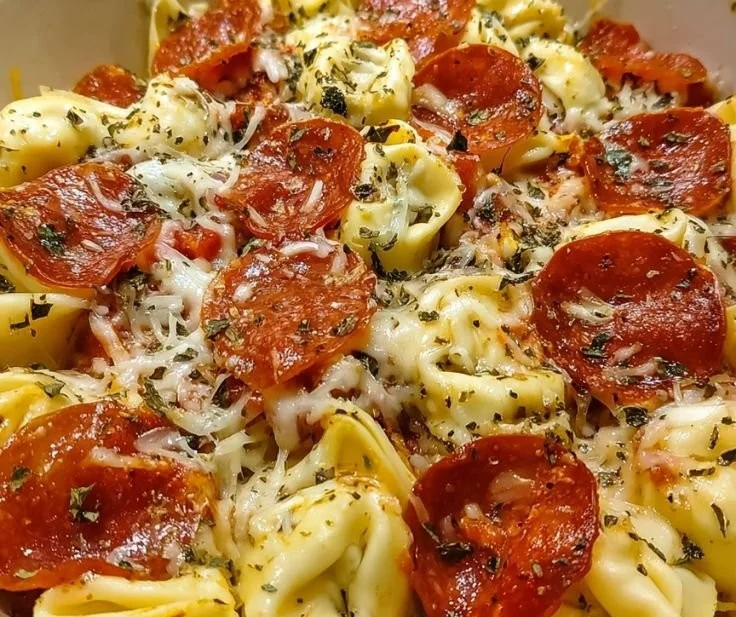 Delicious Cheese Tortellini Pepperoni Pizza topped with cheese and pepperoni.