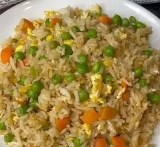 Bowl of easy homemade fried rice with vegetables and eggs