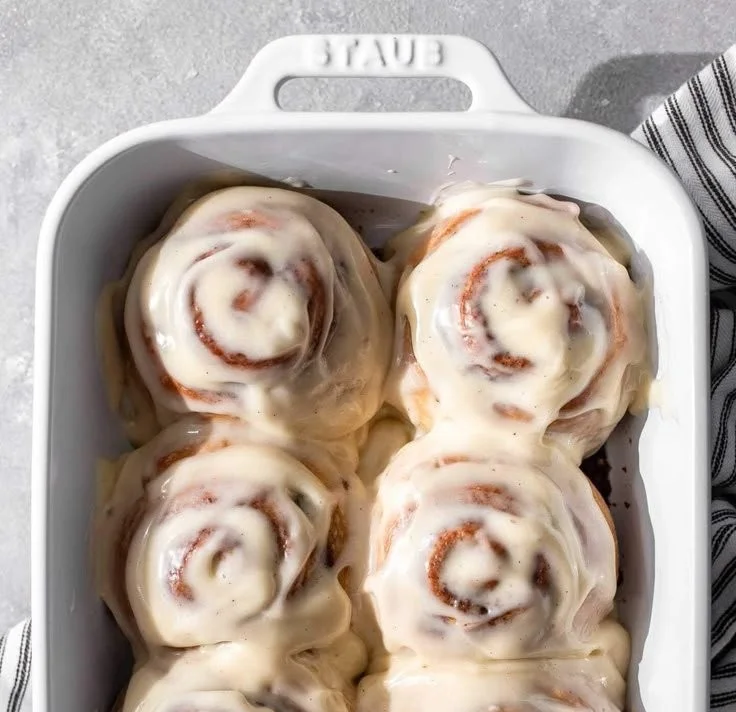 Small batch cinnamon rolls fresh out of the oven, topped with creamy icing.
