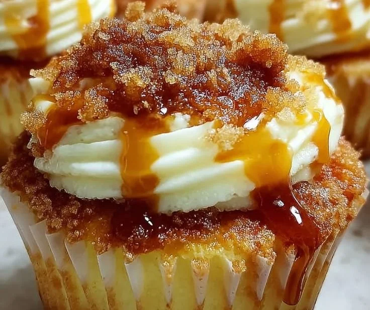 Delicious Vanilla Bean Crème Brûlée Cheesecake Cupcakes with caramelized sugar topping.