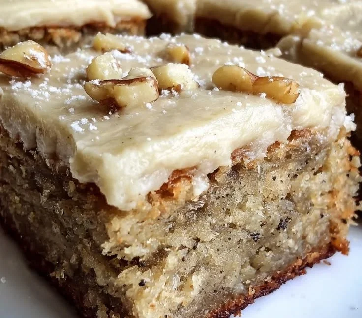 Delicious banana bread brownies with a rich brown butter frosting on top.