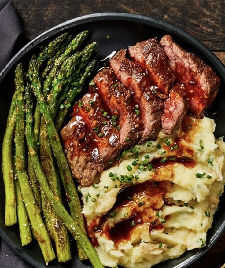Bavette steak cooked with garlic pan sauce on a plate