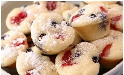 Delicious berry protein pancake bites stacked on a plate