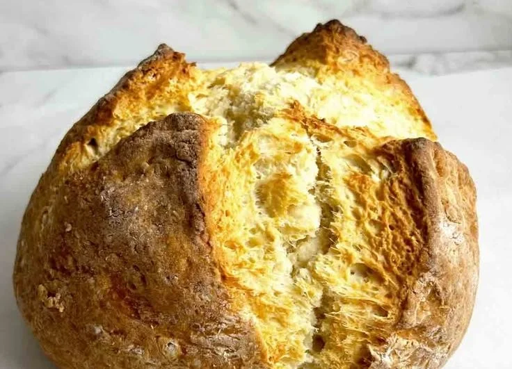 Freshly baked Irish Soda Bread on a wooden table