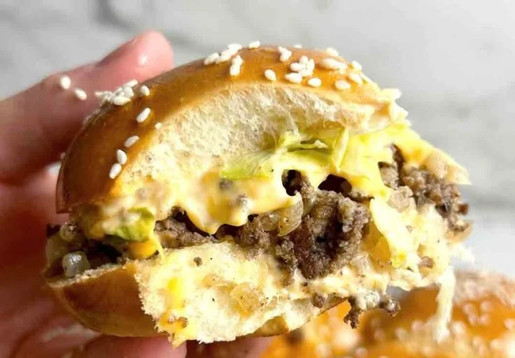 A delicious platter of Big Mac Sliders served with toppings and sauces