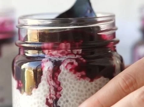 Blueberry Coconut Chia Seed Pudding topped with fresh blueberries and coconut flakes