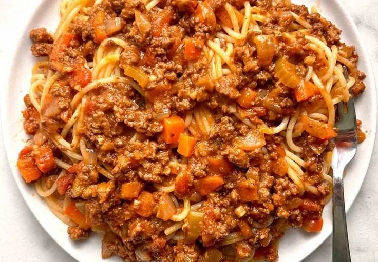 Delicious homemade Bolognese Sauce simmering in a pot