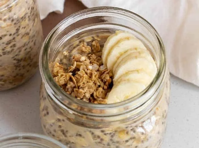 Bowl of brown sugar overnight oats topped with fruits and nuts