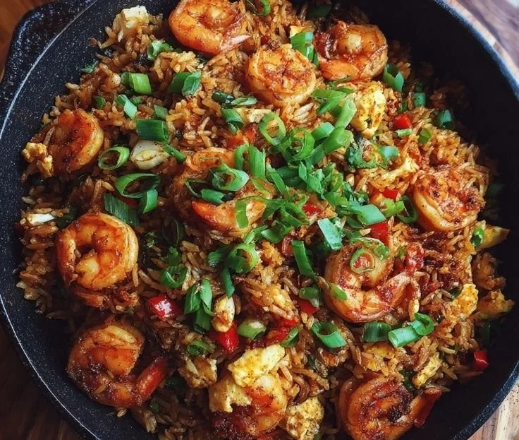 Delicious Cajun shrimp fried rice with vibrant vegetables and spices.