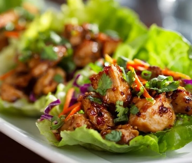 Delicious chicken lettuce wraps P.F. Chang’s style served with dipping sauce