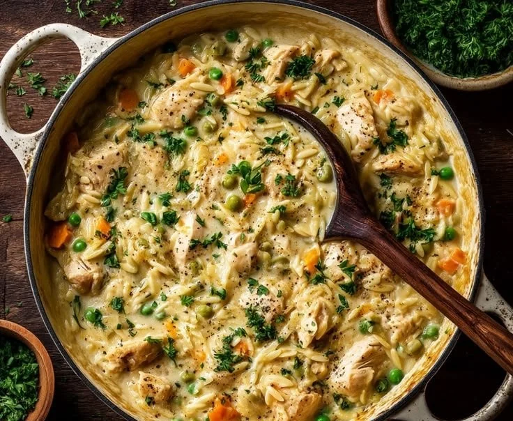 Creamy Chicken Pot Pie Orzo in a bowl garnished with parsley