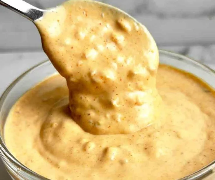 Homemade Big Mac sauce recipe in a bowl with ingredients around it.