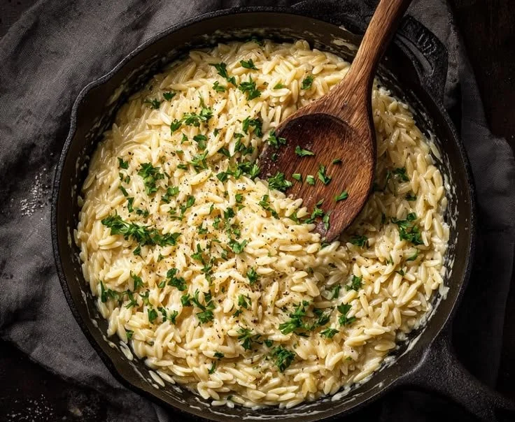 Creamy Garlic Parmesan Orzo dish in a skillet, perfect for a one-pan dinner