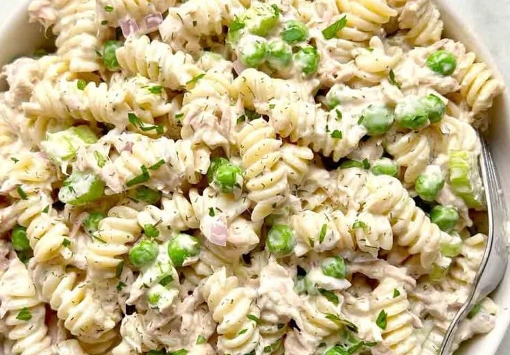 Creamy tuna pasta salad with vegetables in a bowl