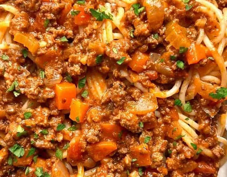 Delicious bowl of easy homemade Bolognese sauce over pasta