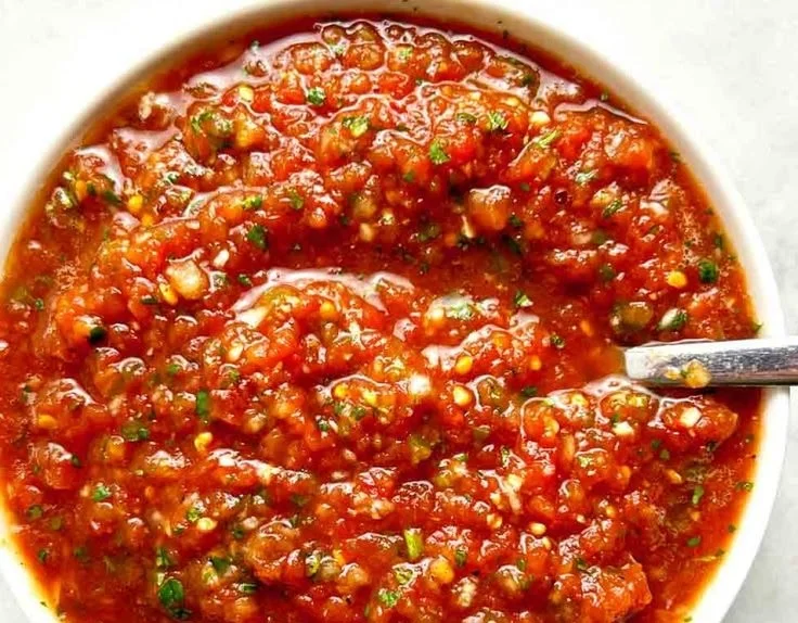 Bowl of easy homemade salsa made with fresh tomatoes and herbs
