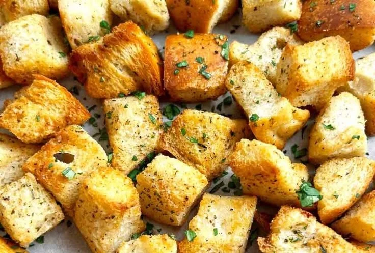 Bowl of easy homemade oven croutons ready to enhance salads and soups.