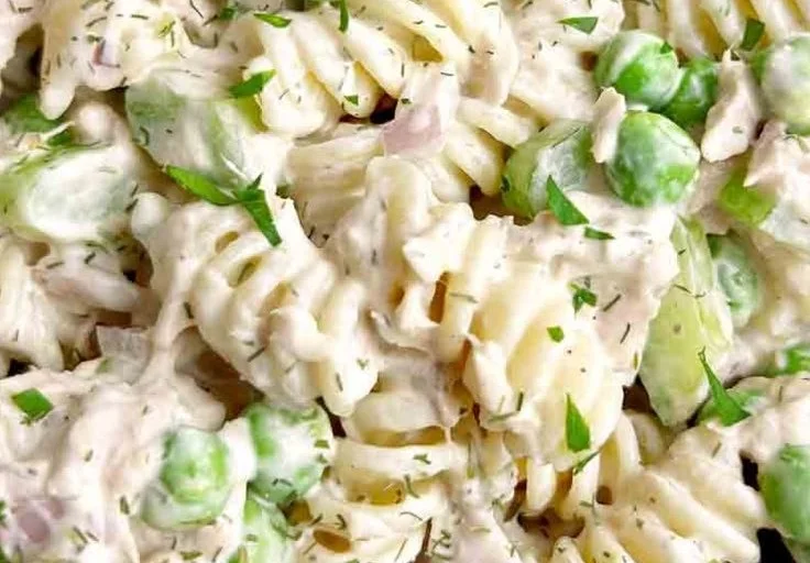 Easy tuna pasta salad served in a bowl with colorful vegetables.