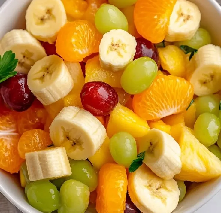 Colorful and fresh fruit salad with a variety of fruits in a bowl