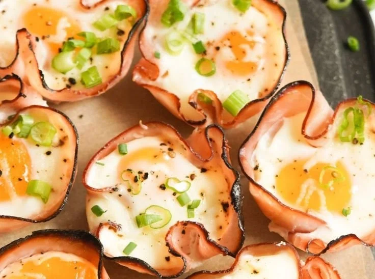 Delicious ham and cheese egg cups recipe served in muffin tray.