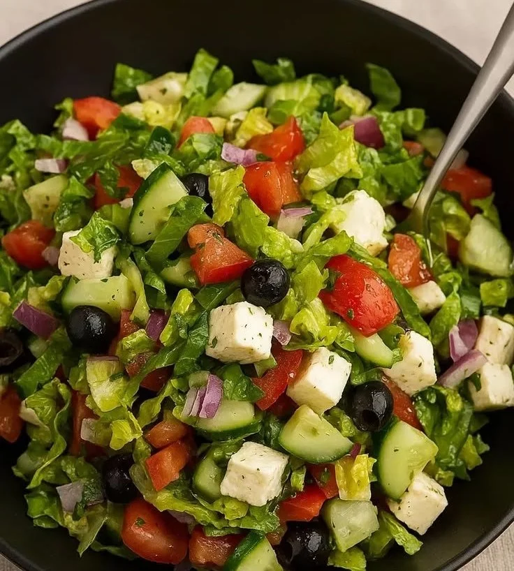 A variety of healthy and nutritious salad recipes displayed in a colorful bowl.