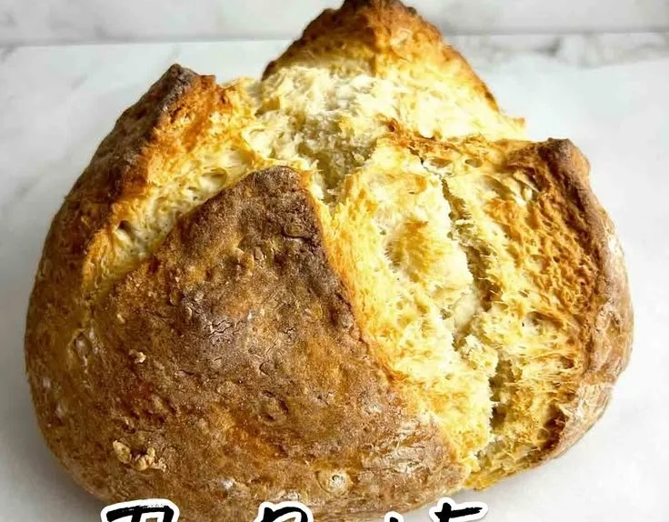 Freshly baked Irish Soda Bread on a wooden table