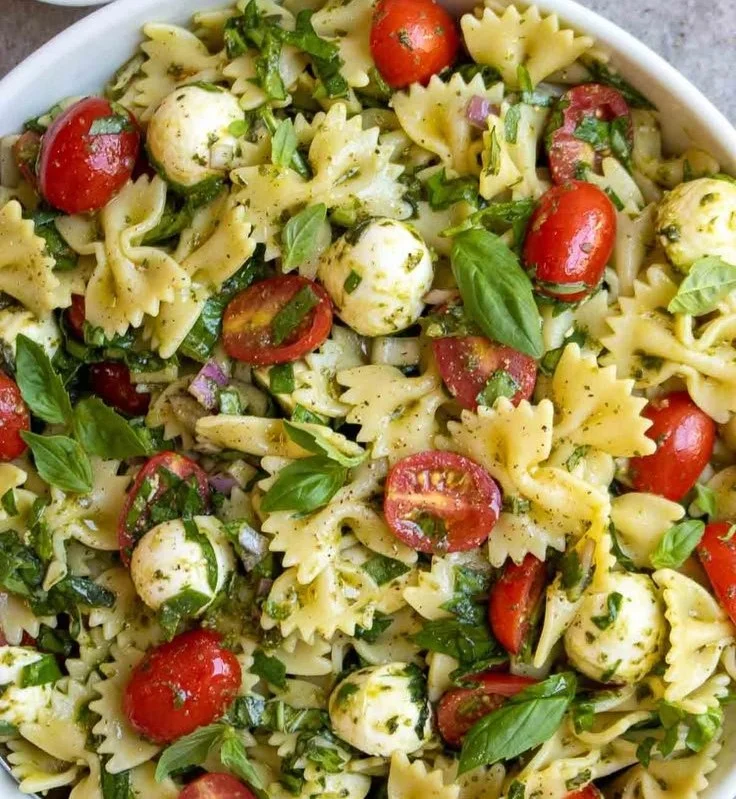 Colorful Italian Bow Tie Pasta Salad with vegetables and dressing