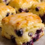 Lemon Blueberry Biscuits served on a plate with fresh berries