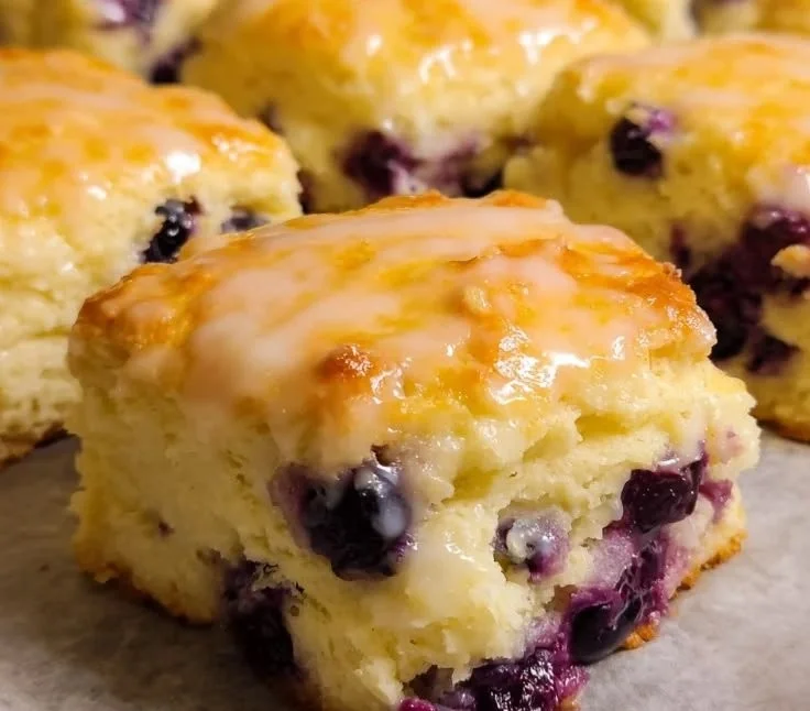 Lemon Blueberry Biscuits served on a plate with fresh berries