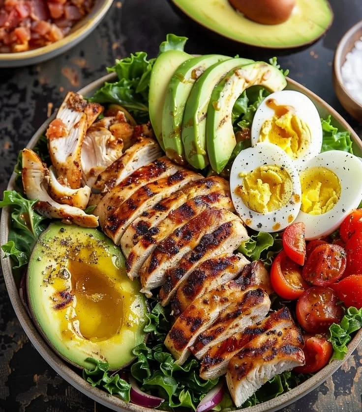 Paleo Grilled Chicken Cobb Salad with Honey Dijon Dressing in a bowl
