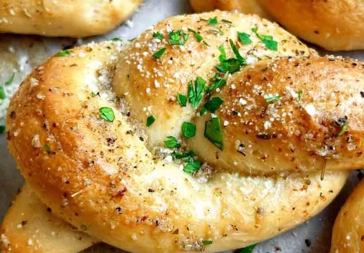 Freshly baked sourdough garlic knots with garlic butter and herbs