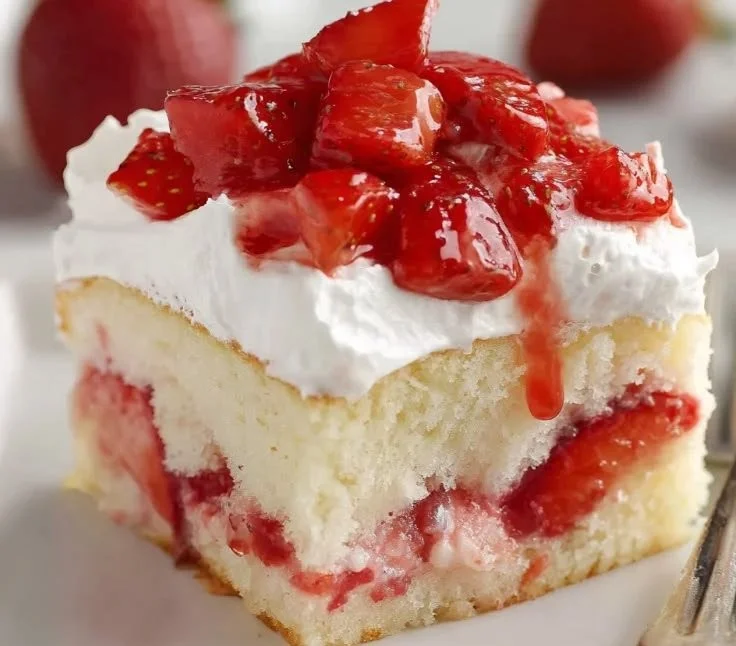 Delicious Strawberry Shortcake Sheet Cake with fresh strawberries and whipped cream
