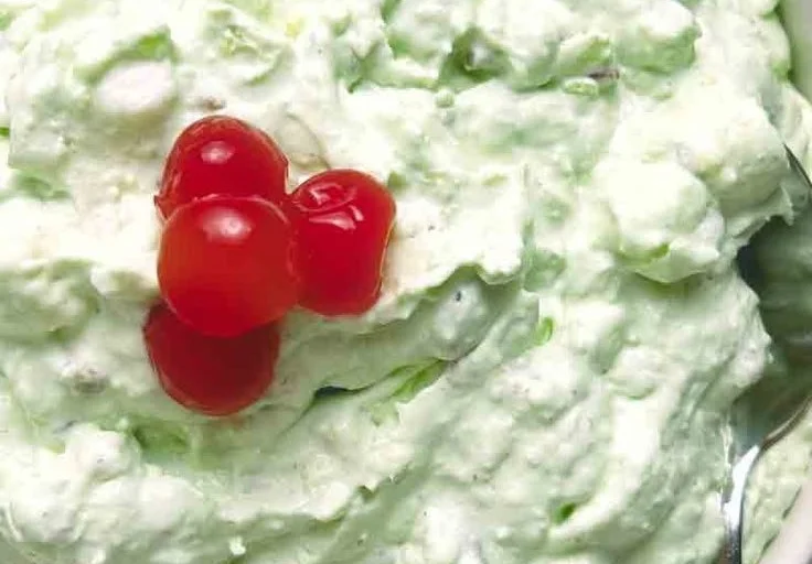 Bowl of Watergate Salad with marshmallows, pineapple, and pistachio pudding