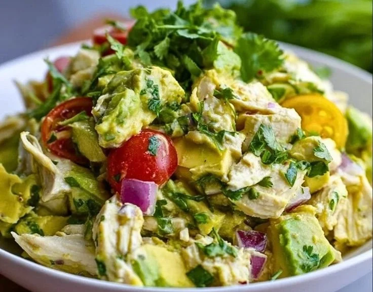 Delicious Avocado Chicken Salad in a bowl with fresh ingredients