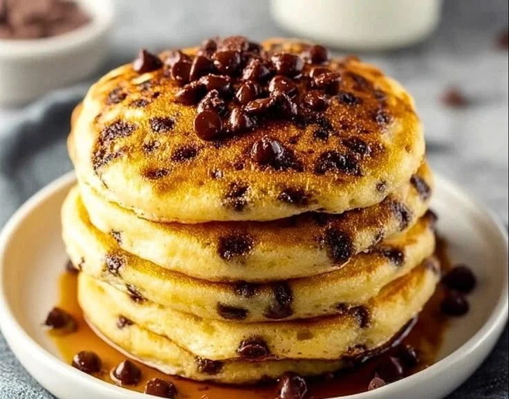 Delicious stack of homemade chocolate chip pancakes topped with syrup