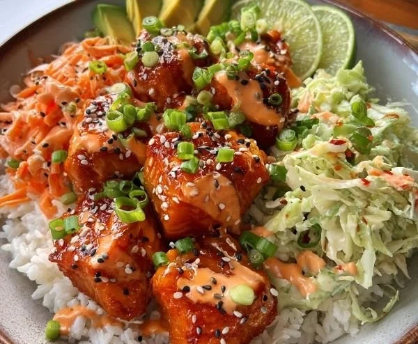 Delicious Crispy Bang Bang Salmon Bites served in a bowl with fresh ingredients.