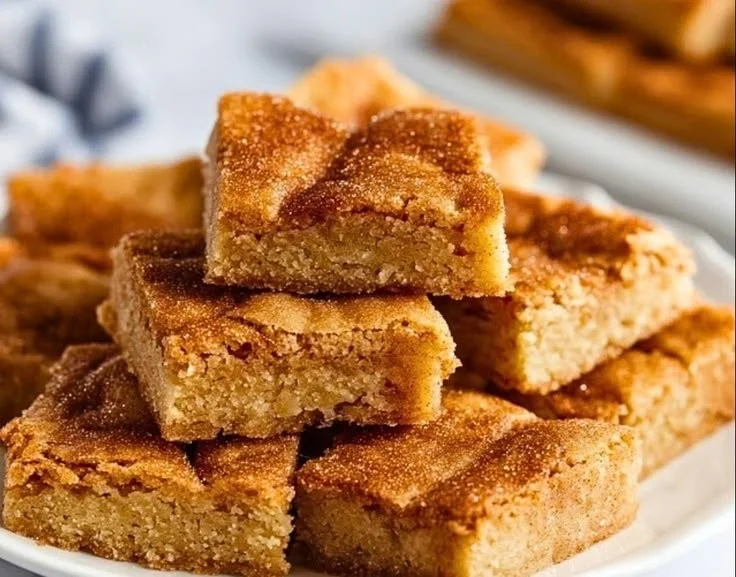 Easy cinnamon sugar blondies baked to perfection, topped with a cinnamon sugar dusting.