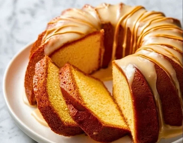 Sliced Eggnog Pound Cake served on a festive plate