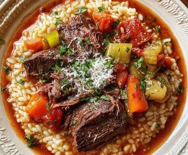Italian-inspired pot roast served with creamy risotto on a rustic table