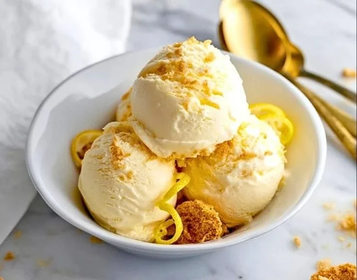 Ninja Creami lemon cheesecake protein ice cream in a bowl with toppings
