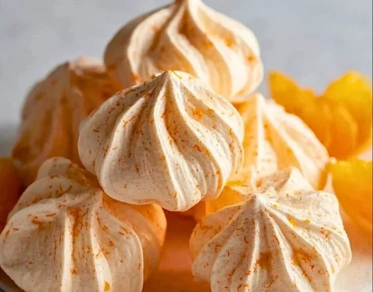 Freshly baked Orange Meringue Cookies with a citrusy twist