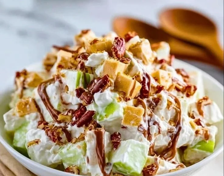 Delicious Snicker Apple Salad made with apples, Snickers, and caramel sauce