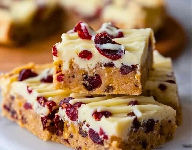 Soft Starbucks Cranberry Bliss Bars with cream cheese frosting and cranberries