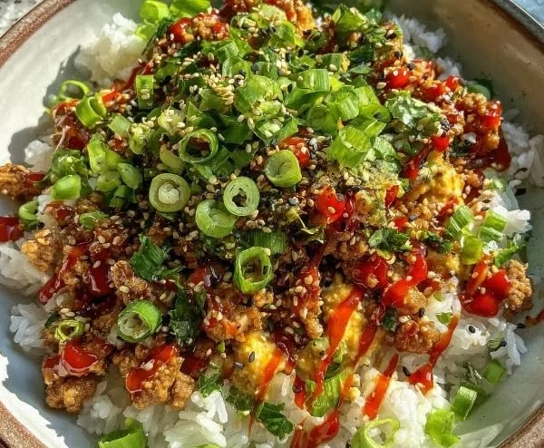 Spicy Bang Bang Turkey rice bowls with vegetables and garnishes