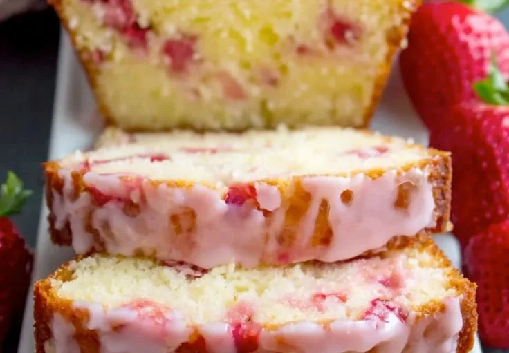 Delicious homemade Strawberry Pound Cake with fresh strawberries and a golden crust.