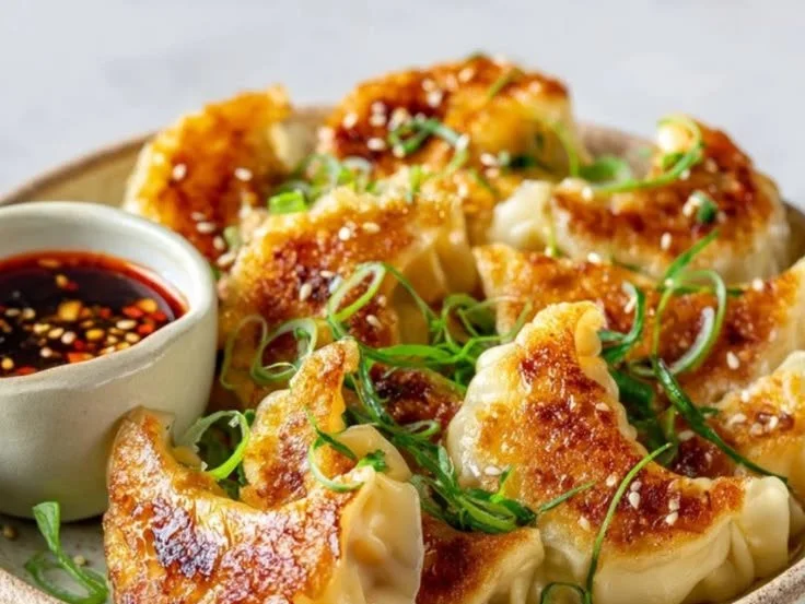 Delicious crispy pan-fried dumplings served in a bowl