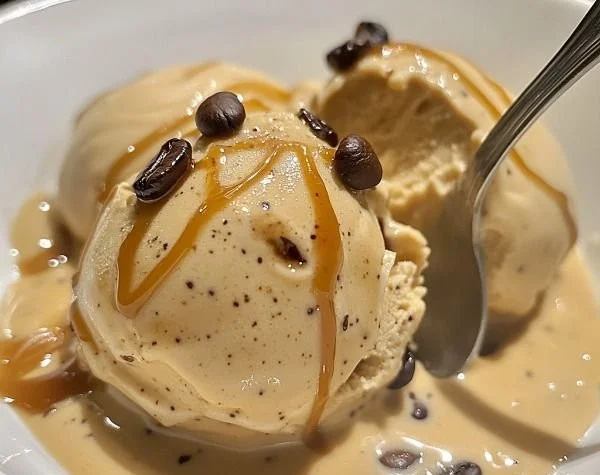 Delicious Italian coffee gelato in a cone topped with coffee beans.