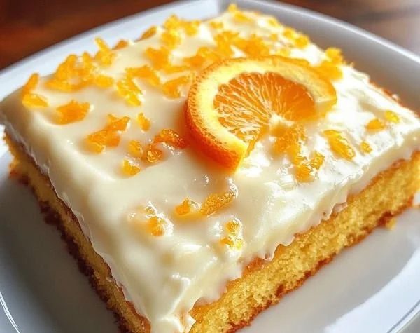 Delicious orange sheet cake topped with orange frosting