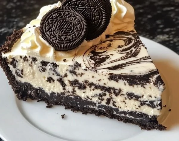 Oreo cheesecake topped with Oreo cookies and cream